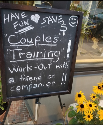 Black Board with an advertisement - Couples Fitness Training by Personal Trainer Milwaukee